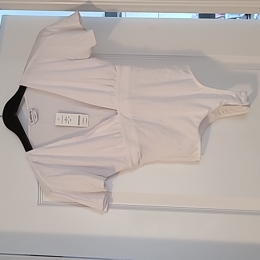 Bebe us XS white short sleeve body suit low v neck cotton